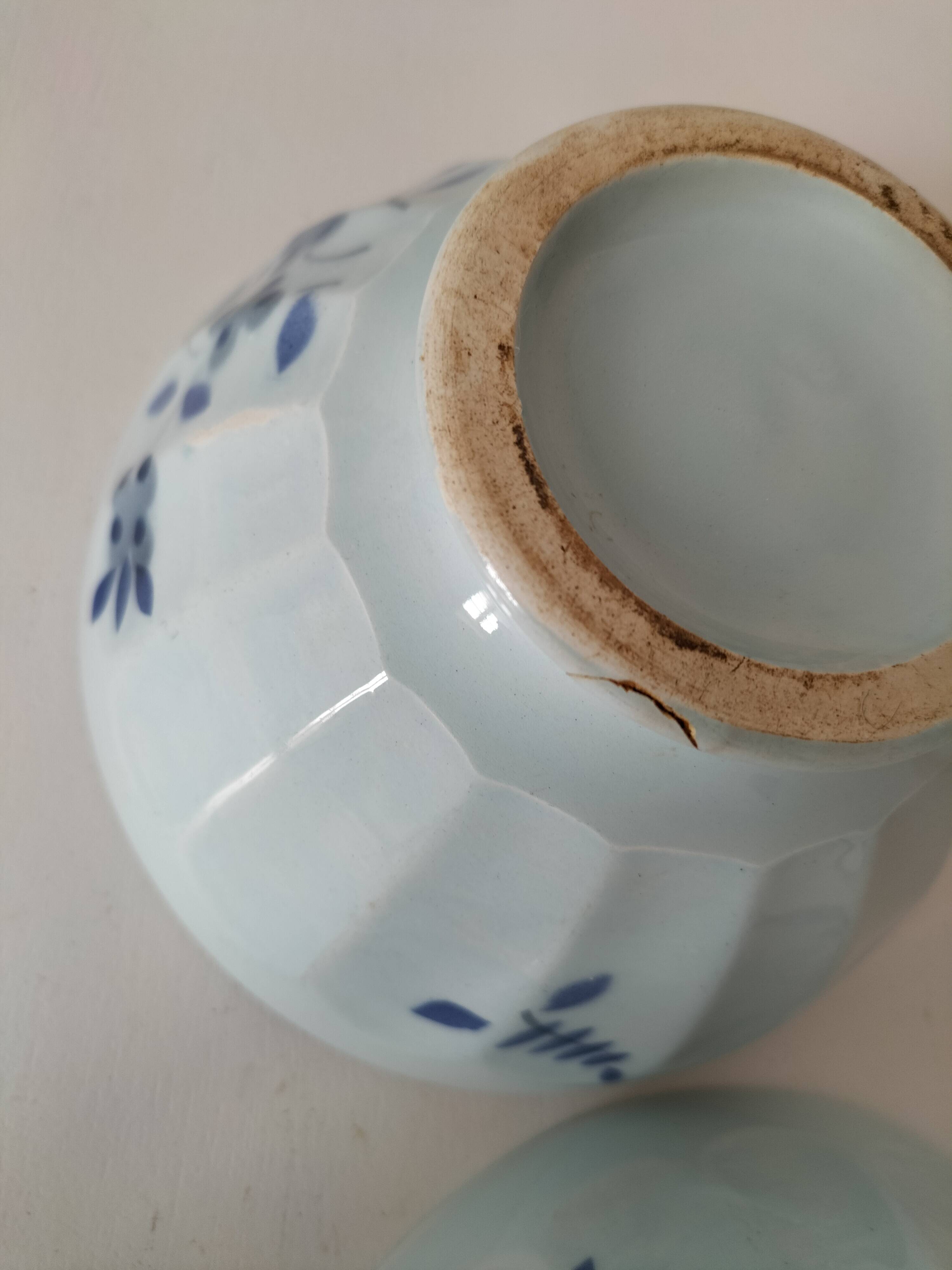 Two vintage farm bowls on a pale blue pedestal with floral decoration.