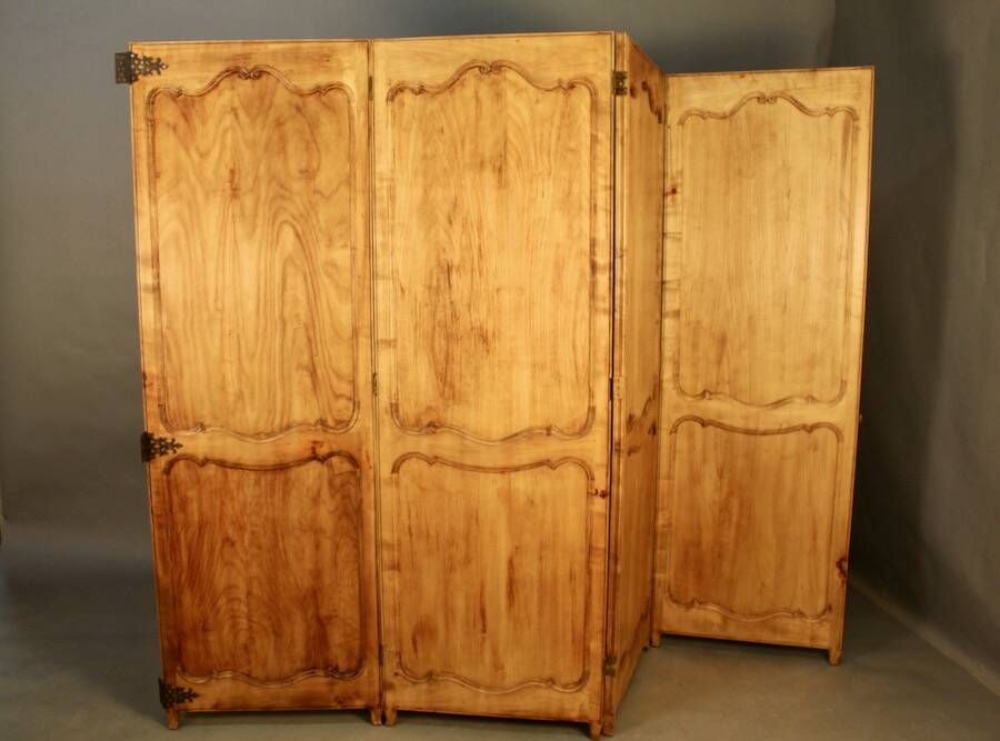 Large cherry wood folding screen with four double-sided panels.