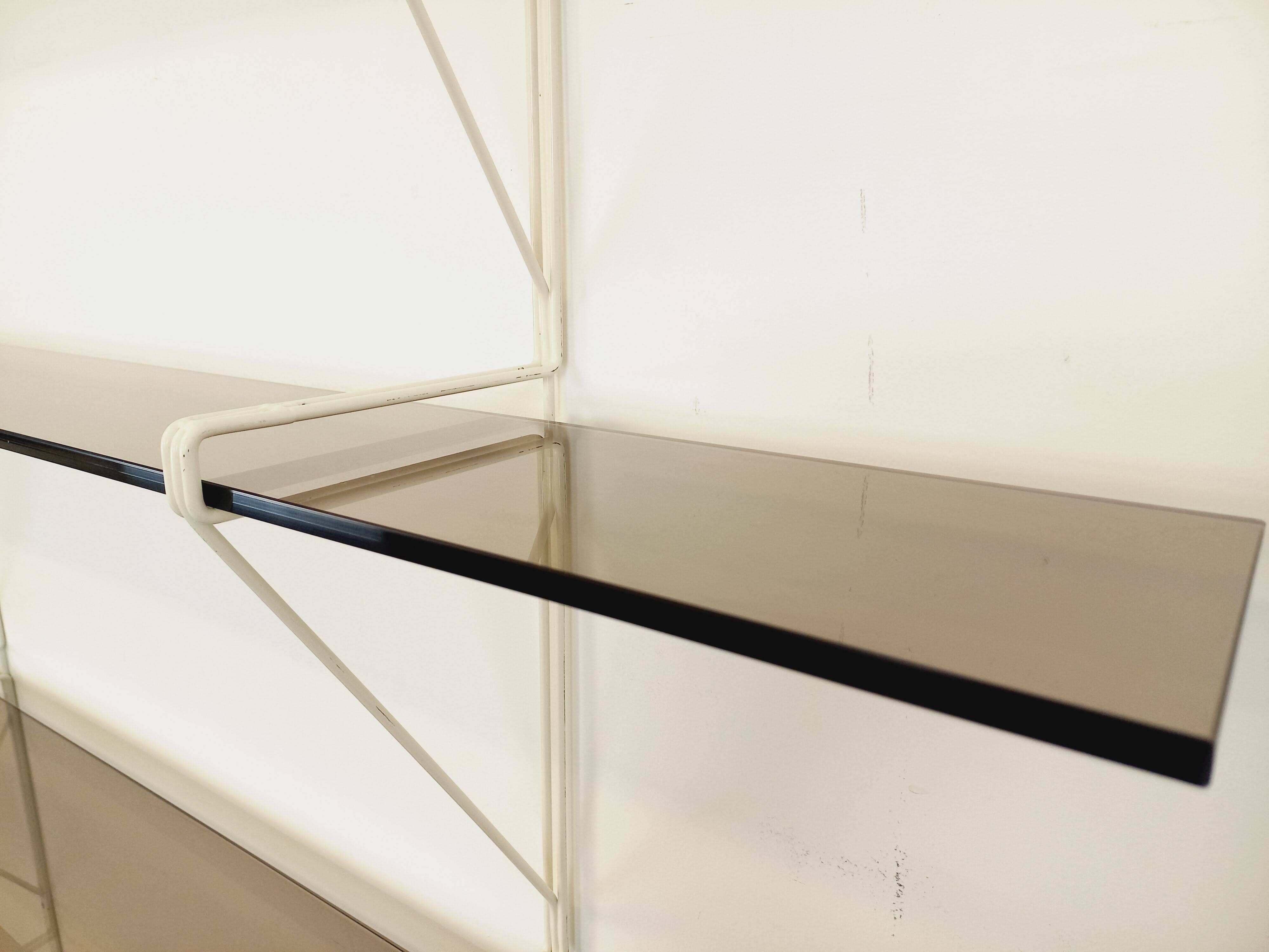 Large vintage wall shelf in smoked glass and white metal in String style.