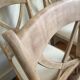 Set of 6 cross-back chairs in solid wood, with white boucle seats.
