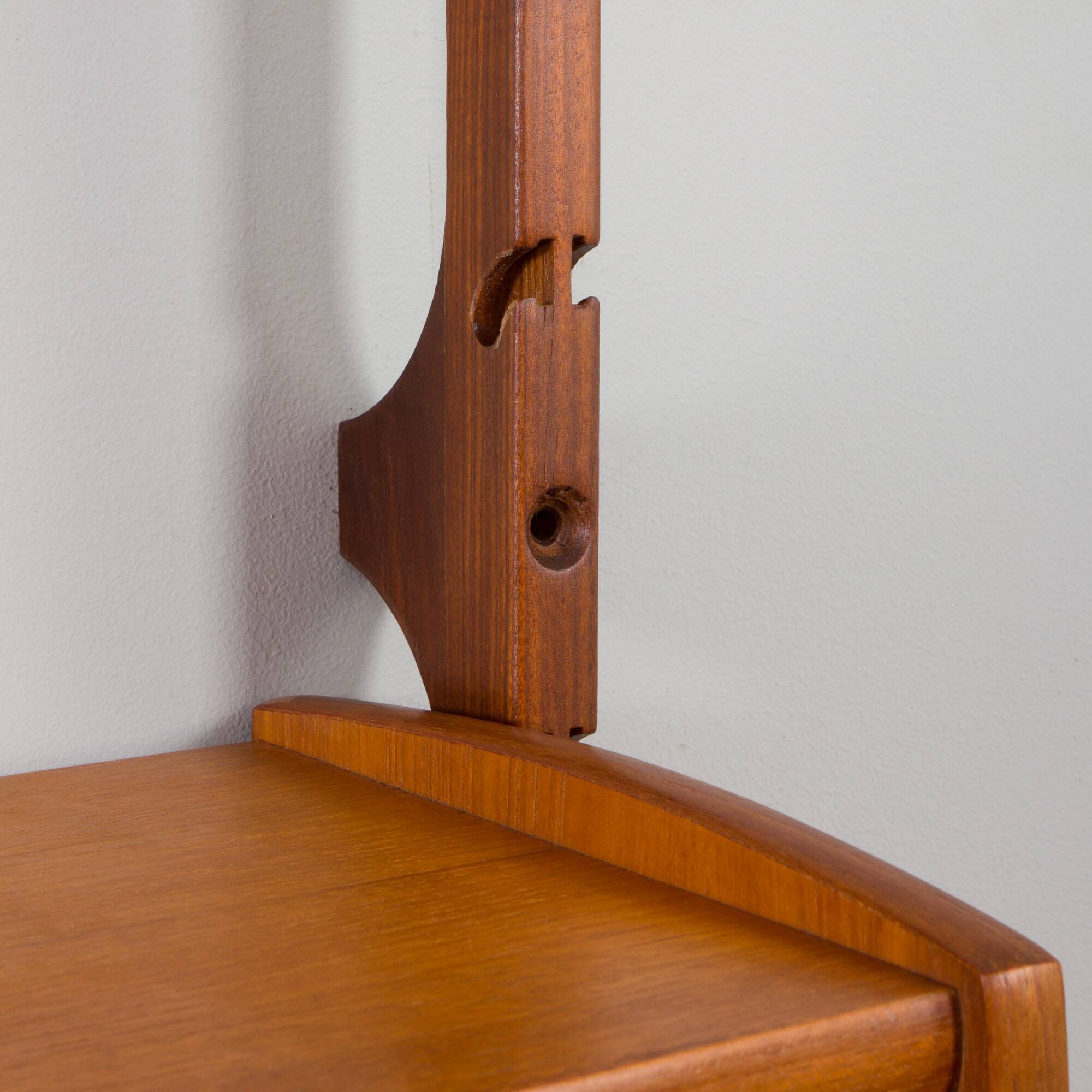 Scandinavian modern wall shelving system Ergo in teak by J. Texmon, Norway, 1960s