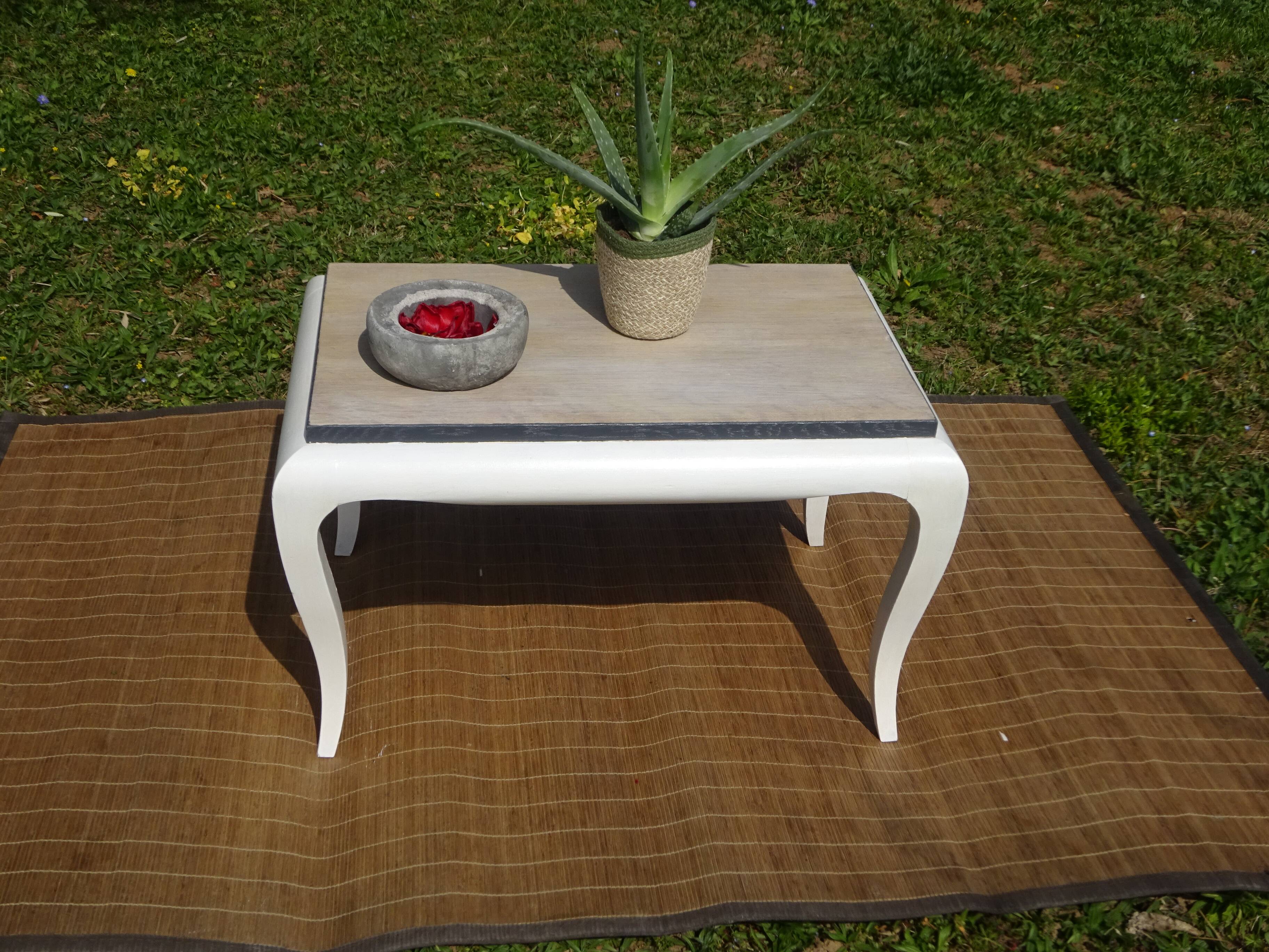 Oak coffee table with curved legs.