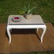 Oak coffee table with curved legs.