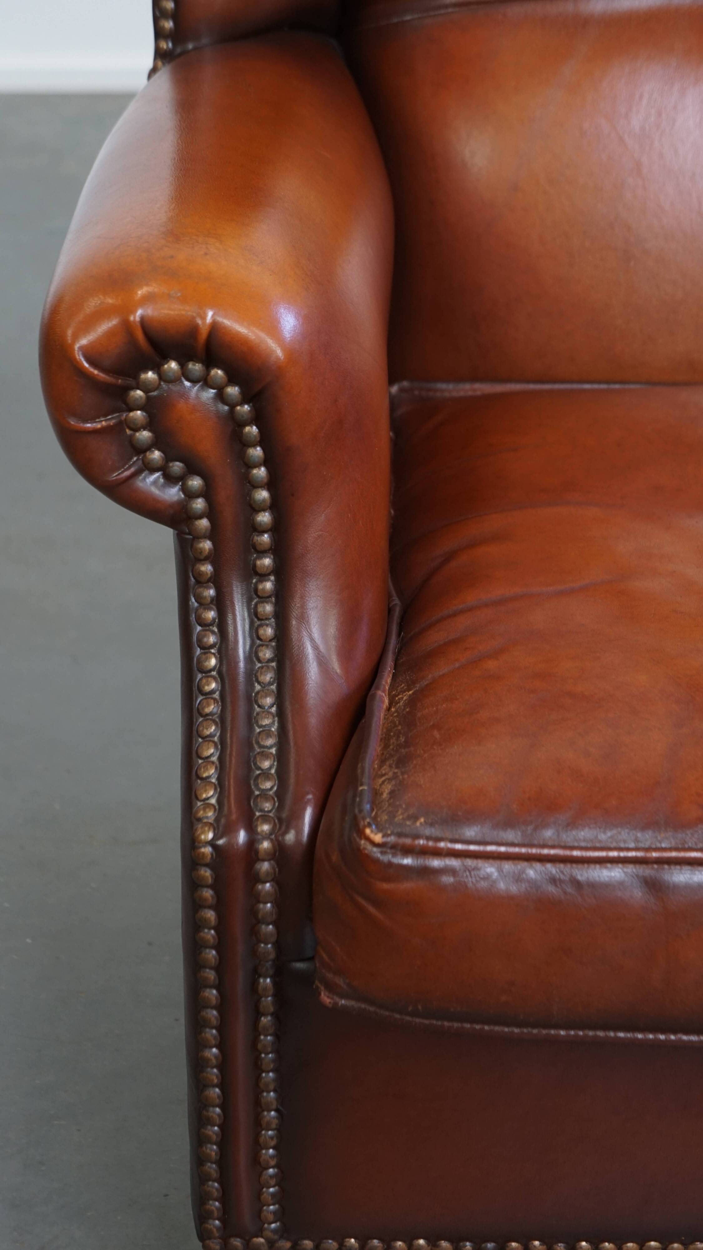 Fauteuil à oreilles en cuir de mouton