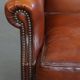 Fauteuil à oreilles en cuir de mouton