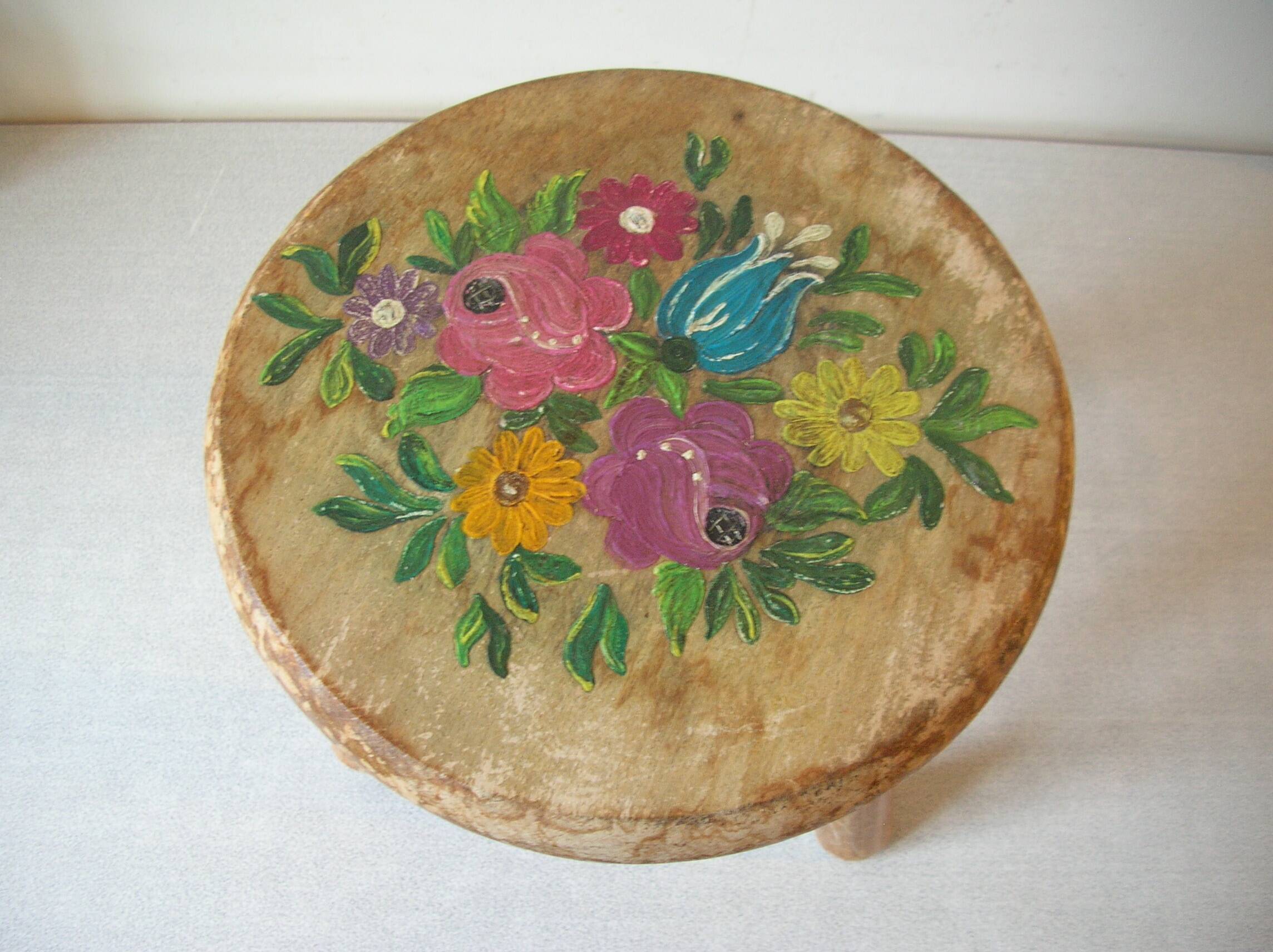 Old tripod stool with 3 wooden legs, painted floral decoration, flower bouquet