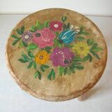 Old tripod stool with 3 wooden legs, painted floral decoration, flower bouquet
