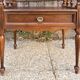 Solid wood bedside table with turned columns, early 20th century.
