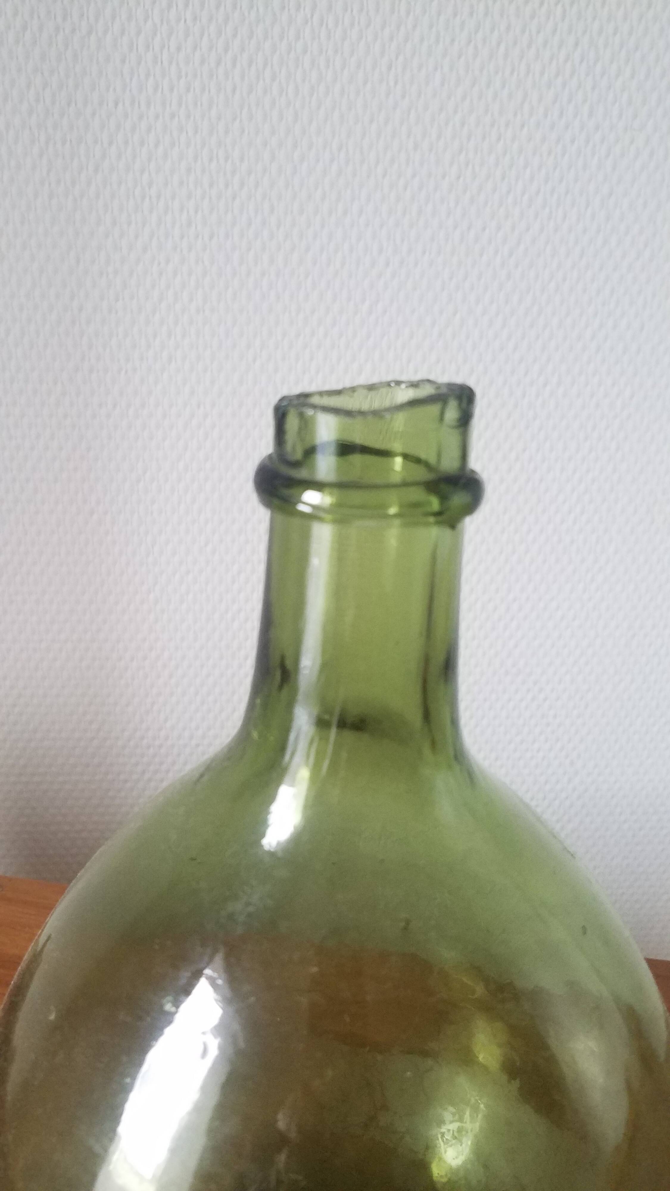Vintage green demijohn