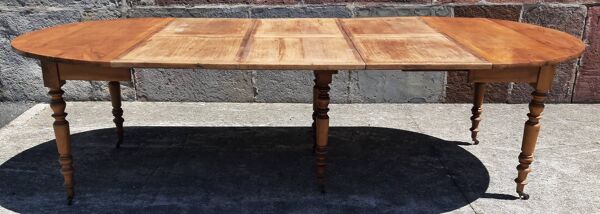 Table ronde extensible (à rallonges et rabats), merisier.