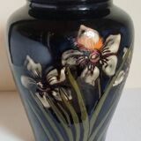 Old enameled earthenware vase with daffodils early 20th century