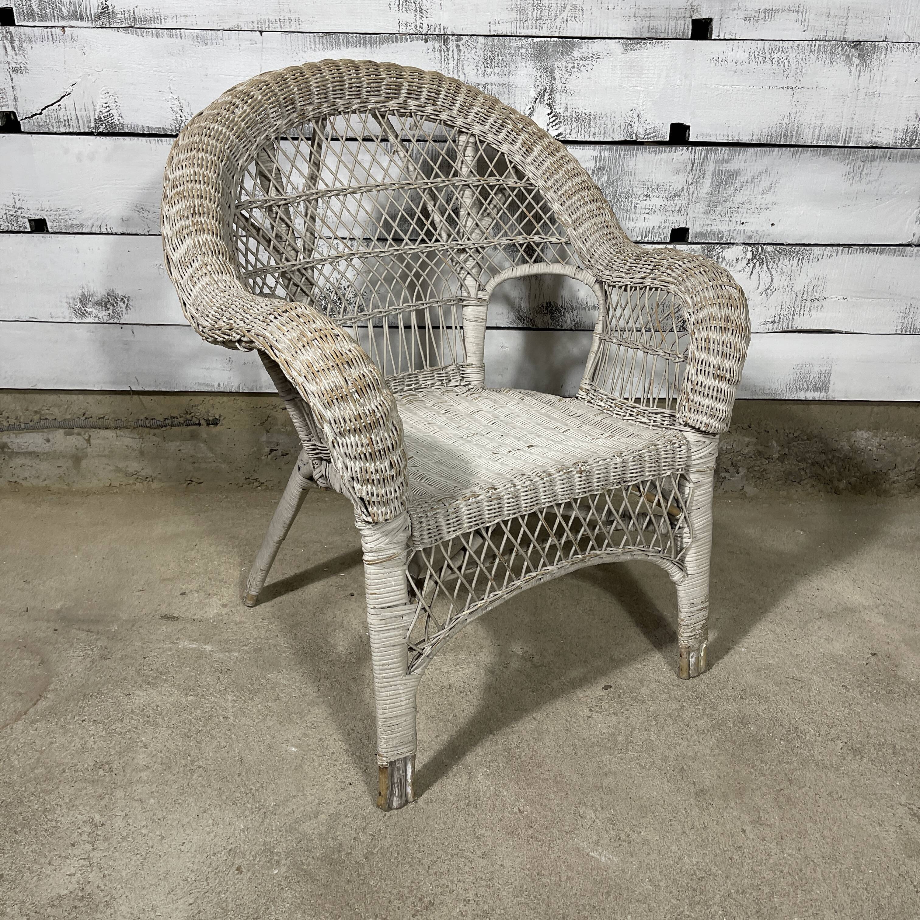 Vintage white rattan armchair