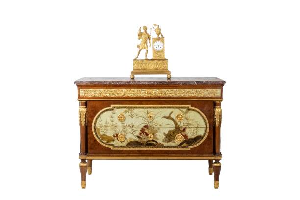 Empire style chest of drawers in lacquer, bronze and marble. Nineteenth century.