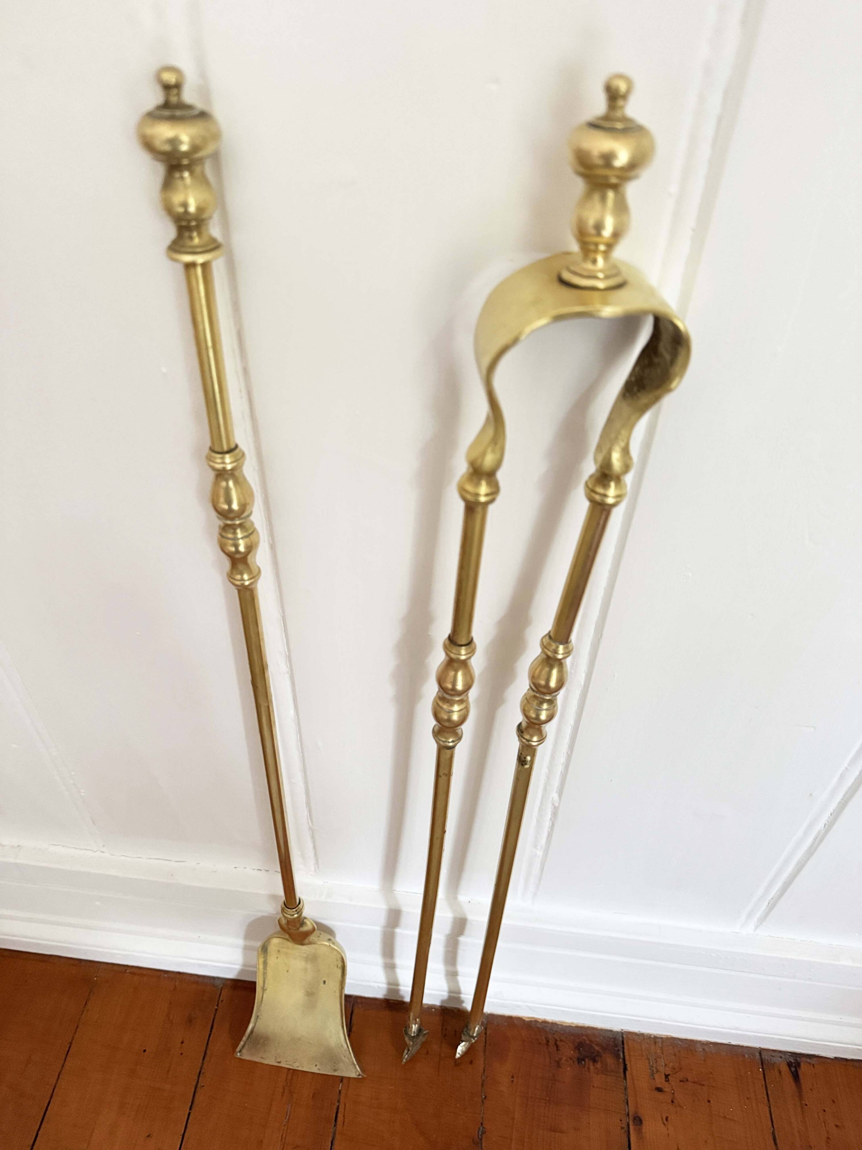 19th-century brass fireplace tongs and shovel.
