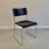 4 Spilimbergo chairs from Italy in chrome steel and black plastic.