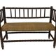 Vintage 'bobbin' bench with a rush seat, 1920s design with armrests.