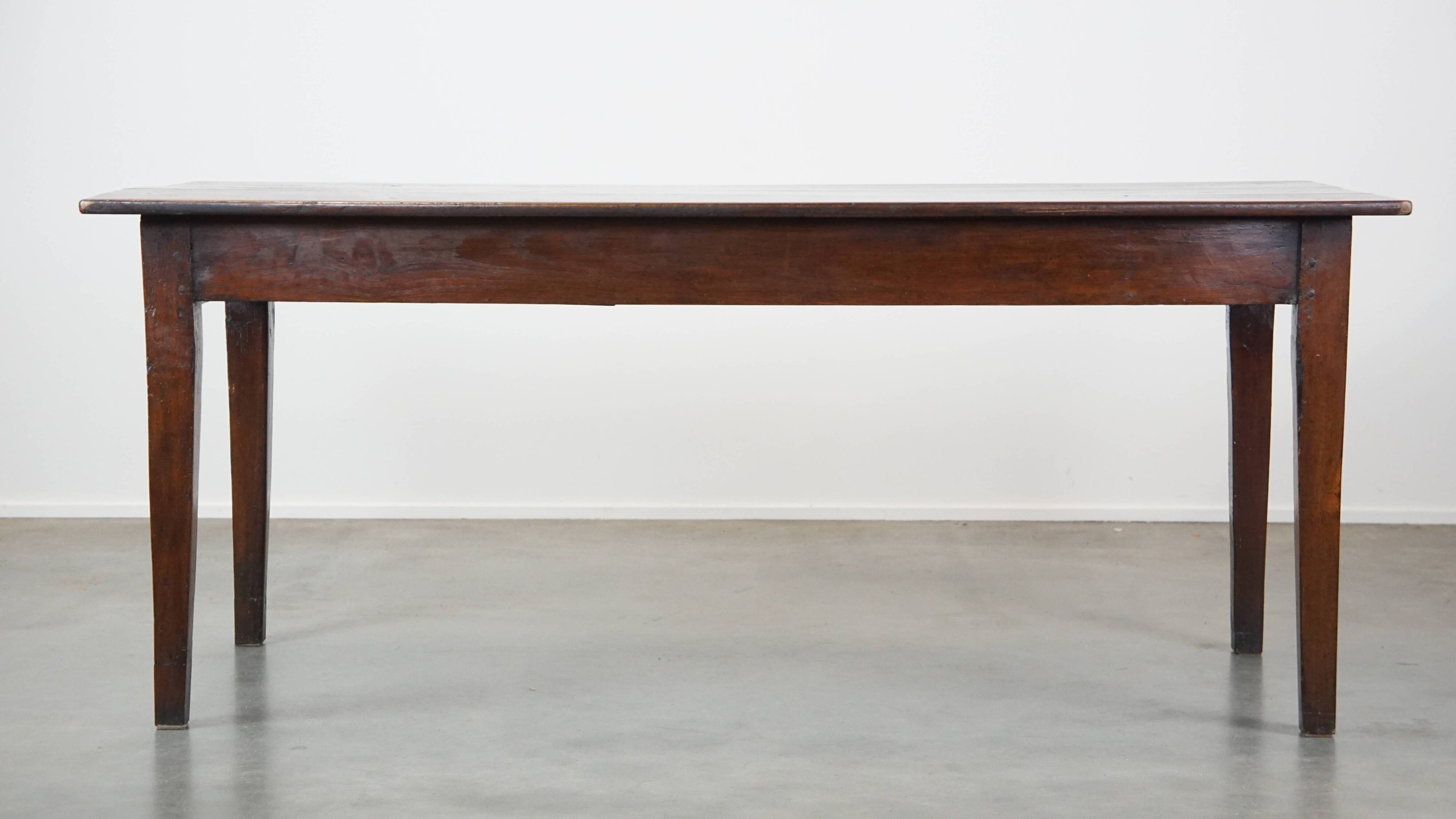 Antique French fruitwood dining table with 2 drawers and patina