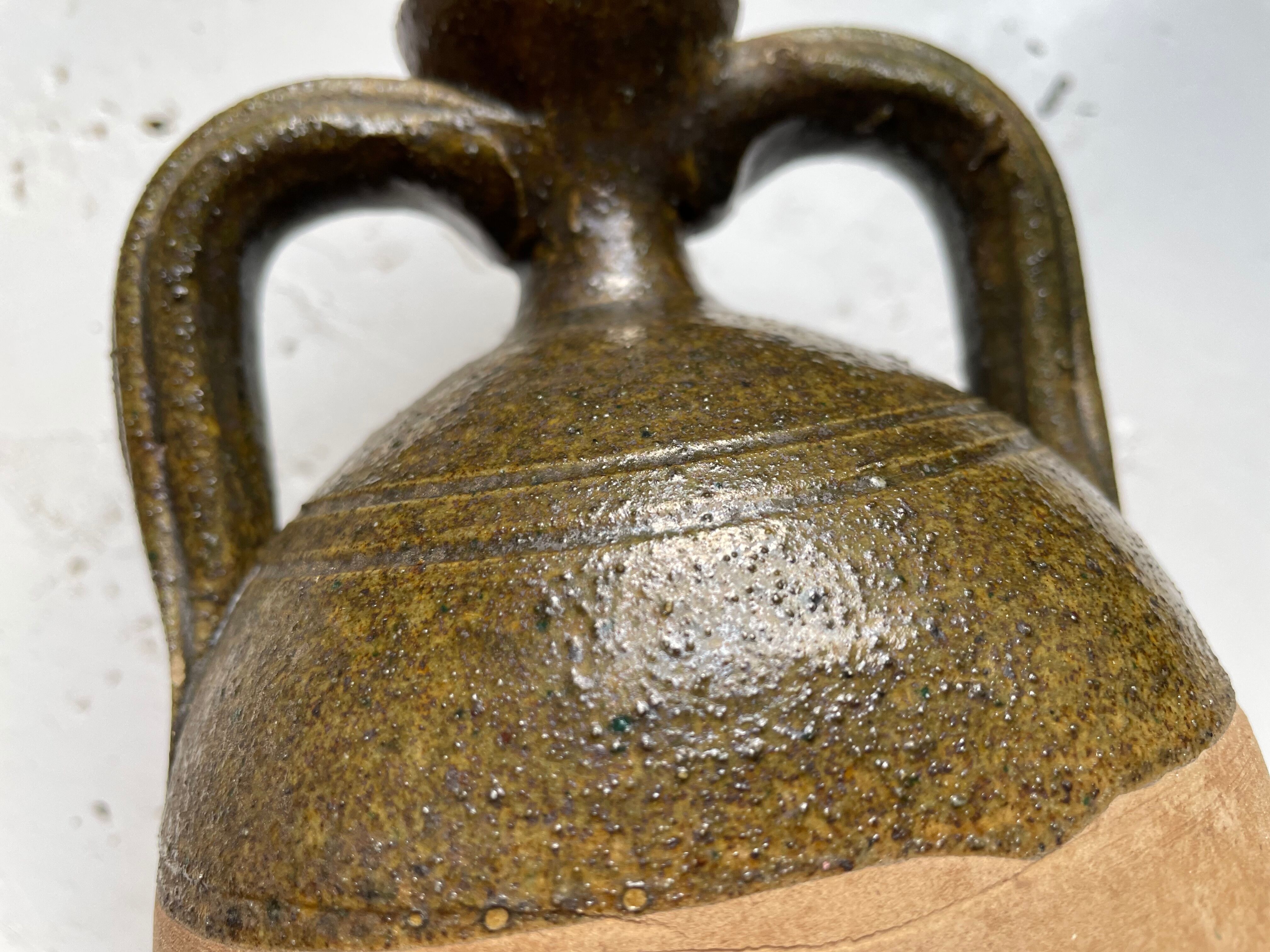 Persimmon glazed terracotta oil jar