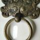 Ancient door knocker, taotié mask, shang dynasty. in bronze golden patina