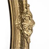 Oval mirror in a golden frame