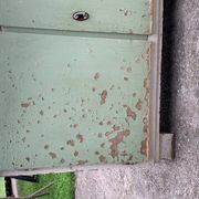 Vintage low wooden cabinet painted green and white with a floral fabric top (1950s)