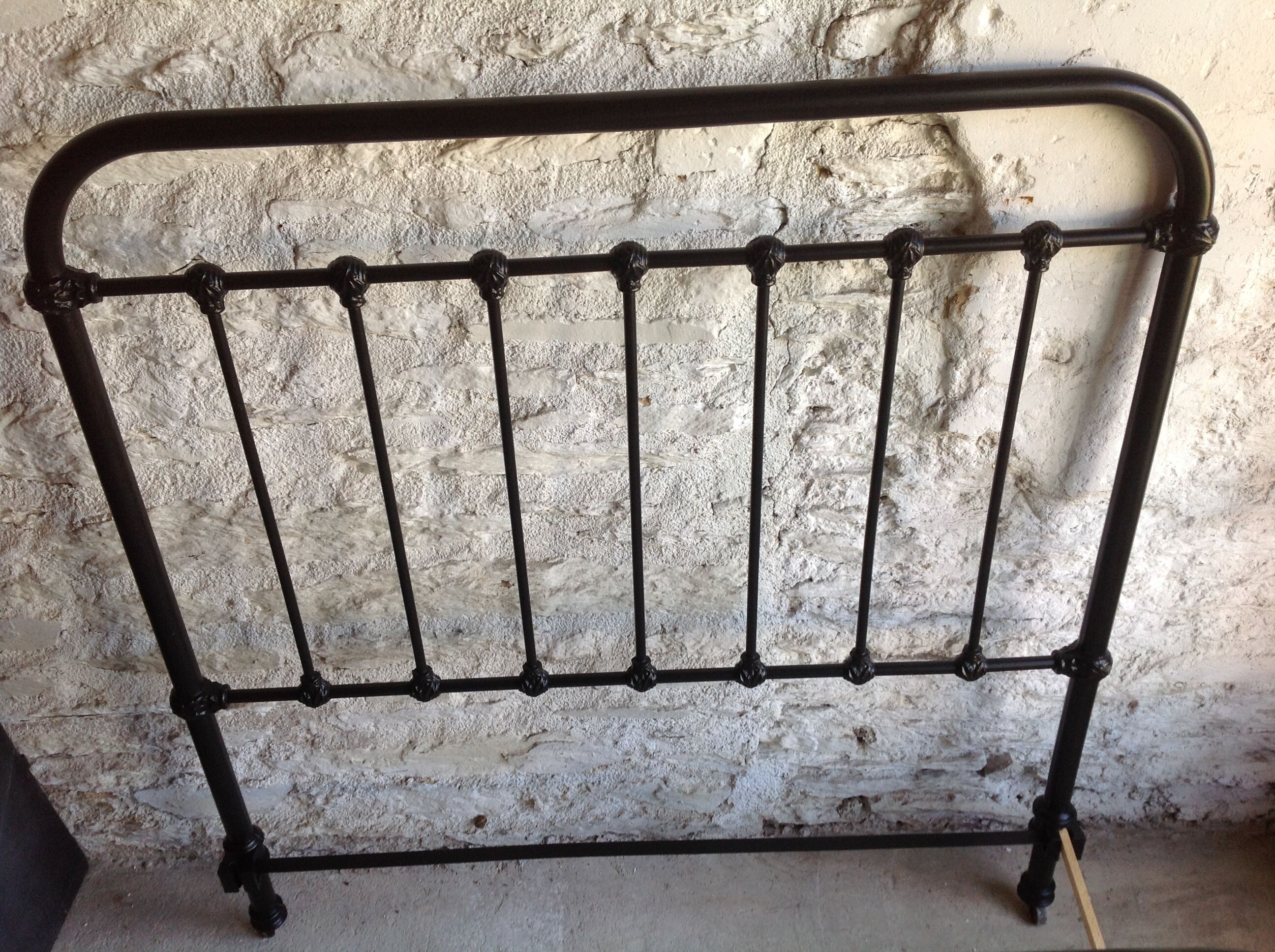old bed with vintage painted metal bars