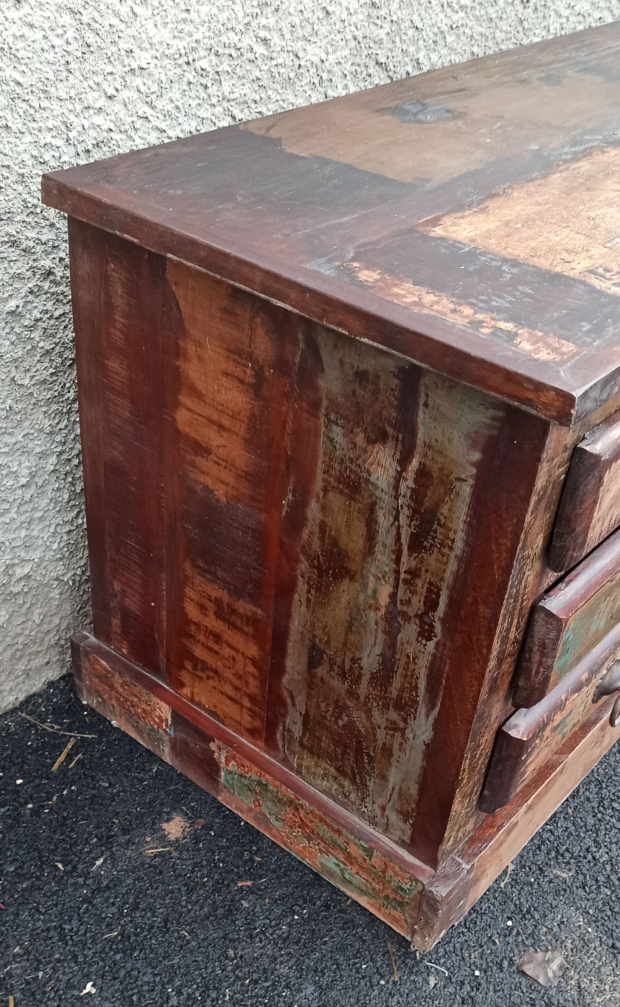 Furniture low in colorful wood. 12 drawers and 1 door