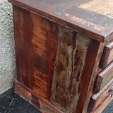 Furniture low in colorful wood. 12 drawers and 1 door