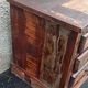 Furniture low in colorful wood. 12 drawers and 1 door