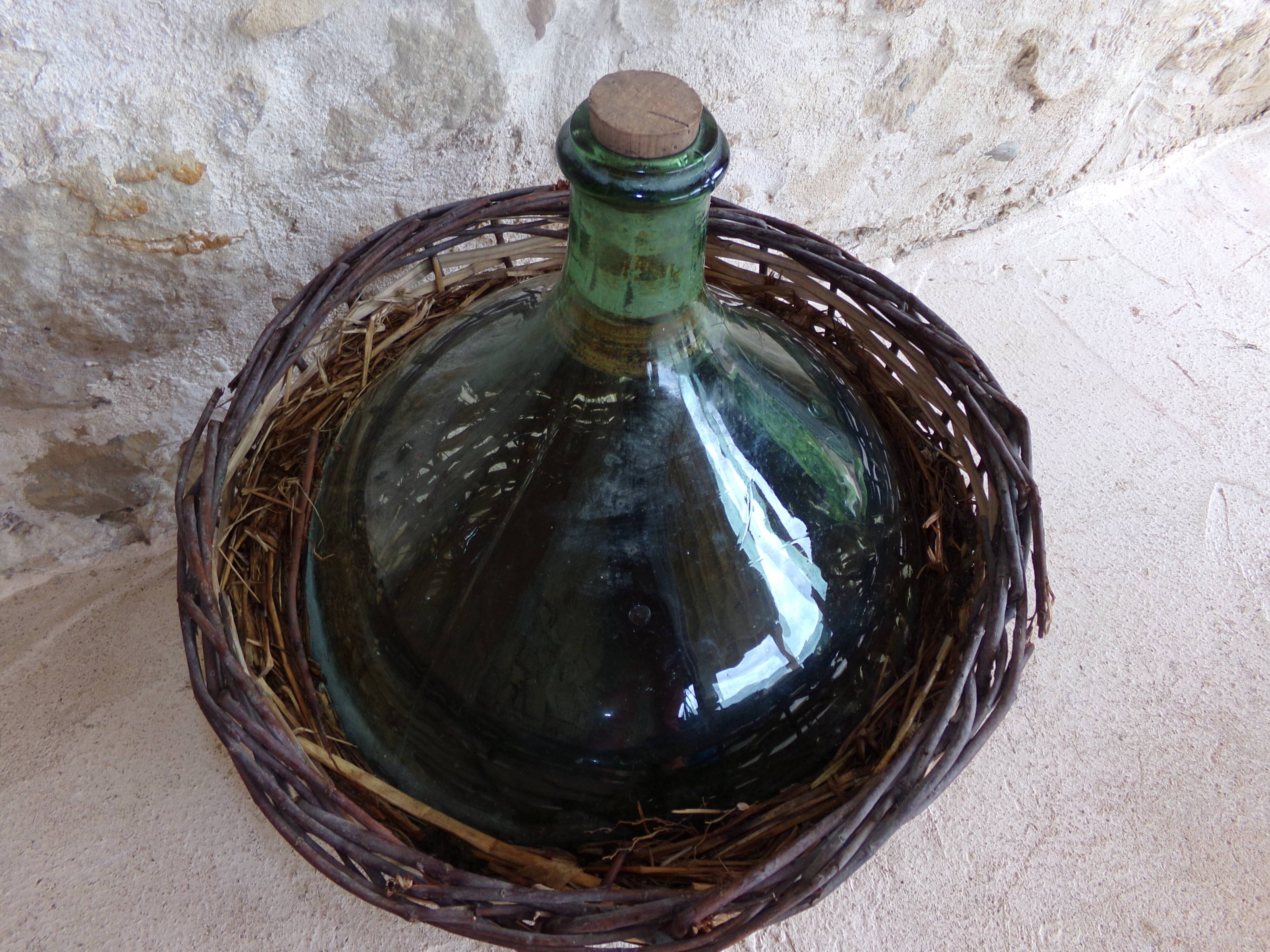 Dame-jeanne in her basket