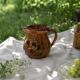Glazed earthenware pitcher signed HR with a design of stylised birds.