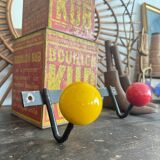 Wall coat rack with vintage colored balls