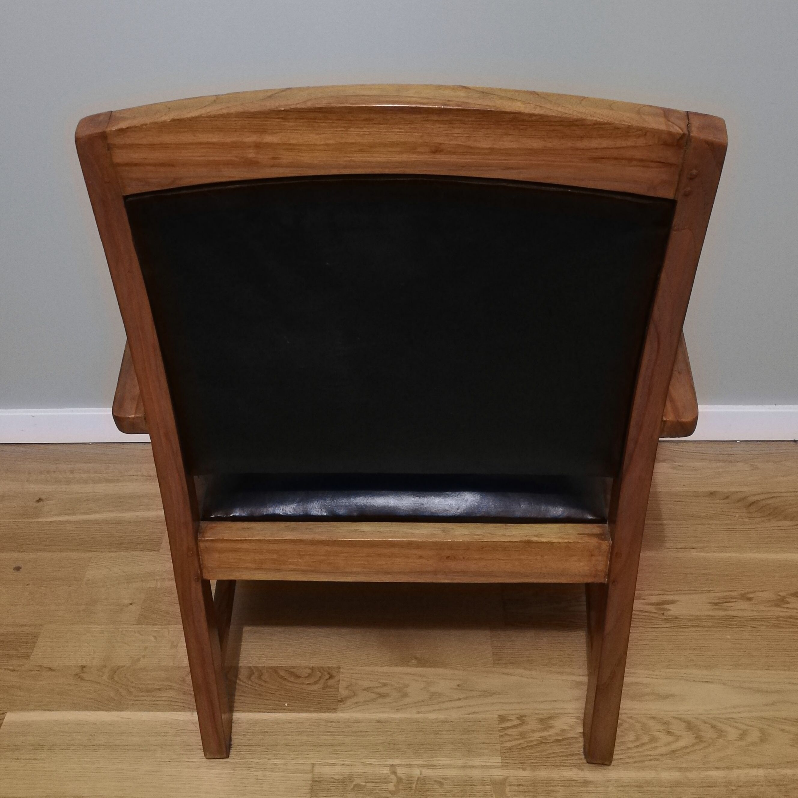 Colonial armchair in teak and black leather
