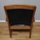 Fauteuil colonial en teck et cuir noir