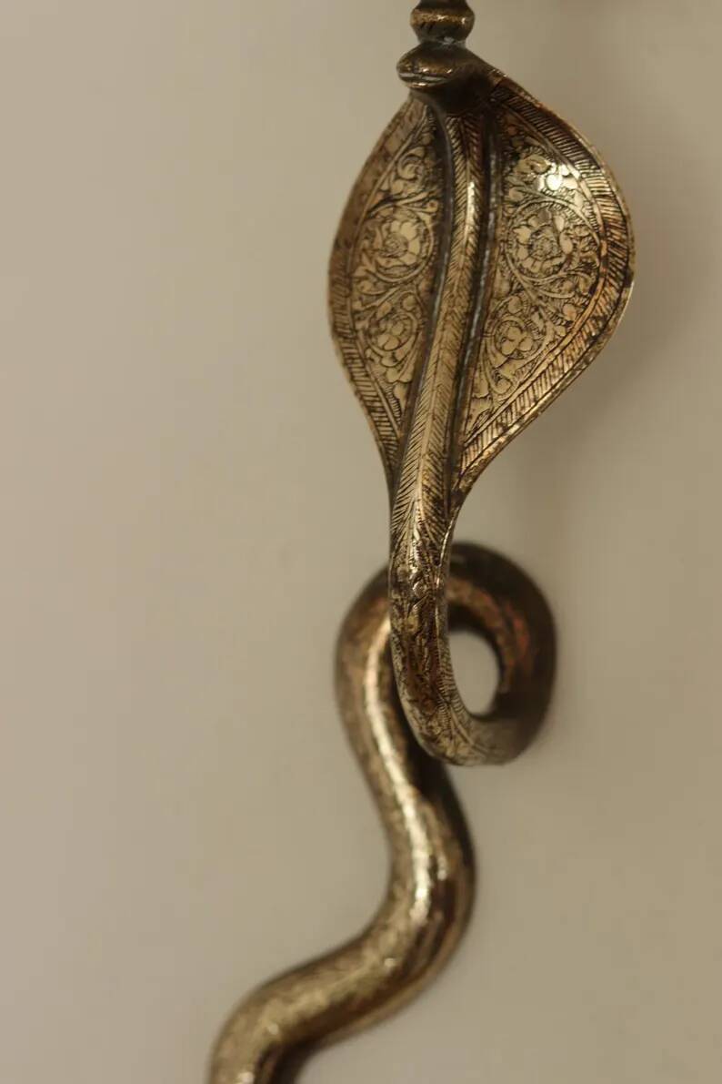 Pair of Neo-Egyptian Style Engraved Brass Wall Sconces Featuring Cobras