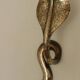Pair of Neo-Egyptian Style Engraved Brass Wall Sconces Featuring Cobras