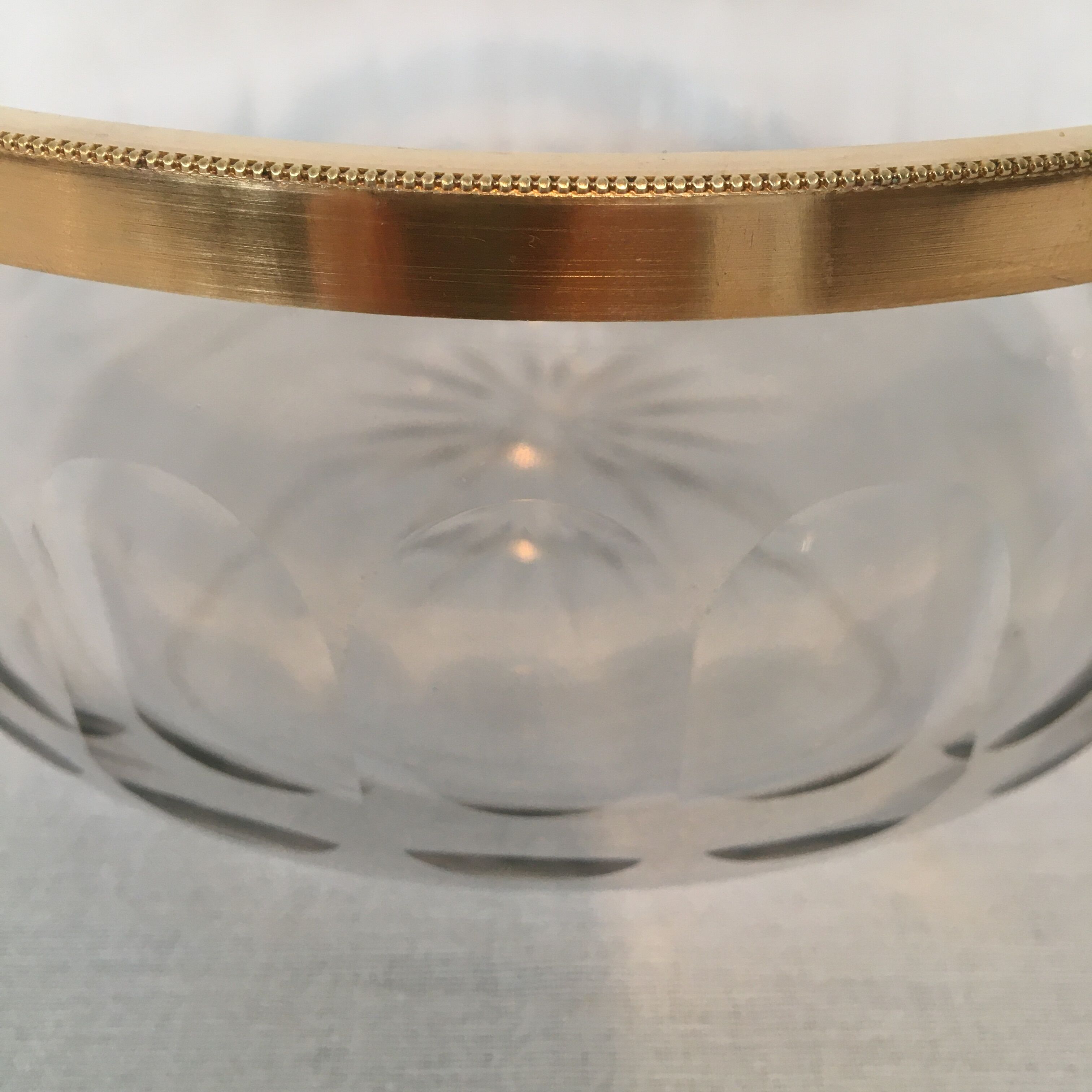 Crystal bowl trimmed surrounded gold metal