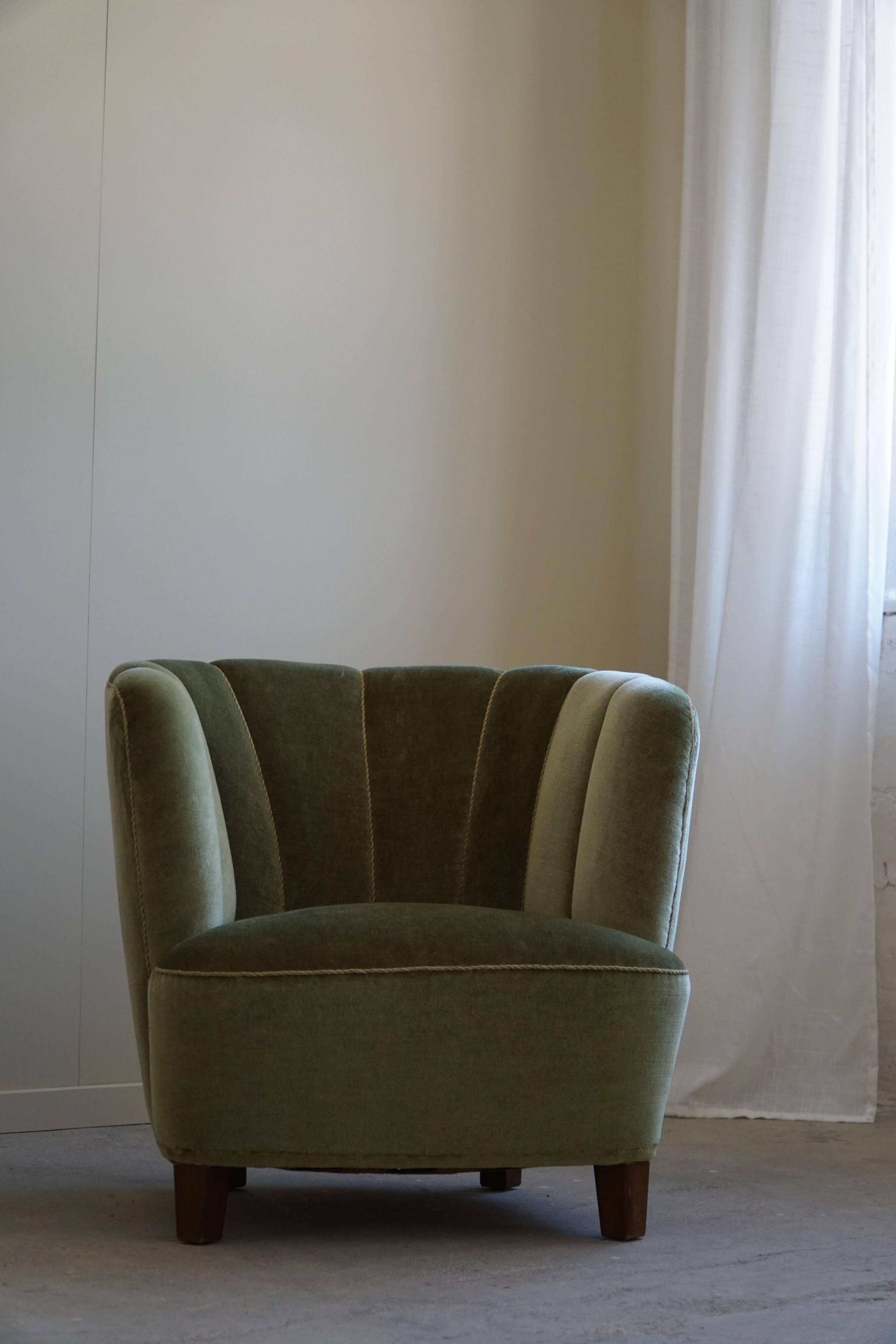 Curved Danish club chair from the mid-century, in the style of Viggo Boesen, 1940s.