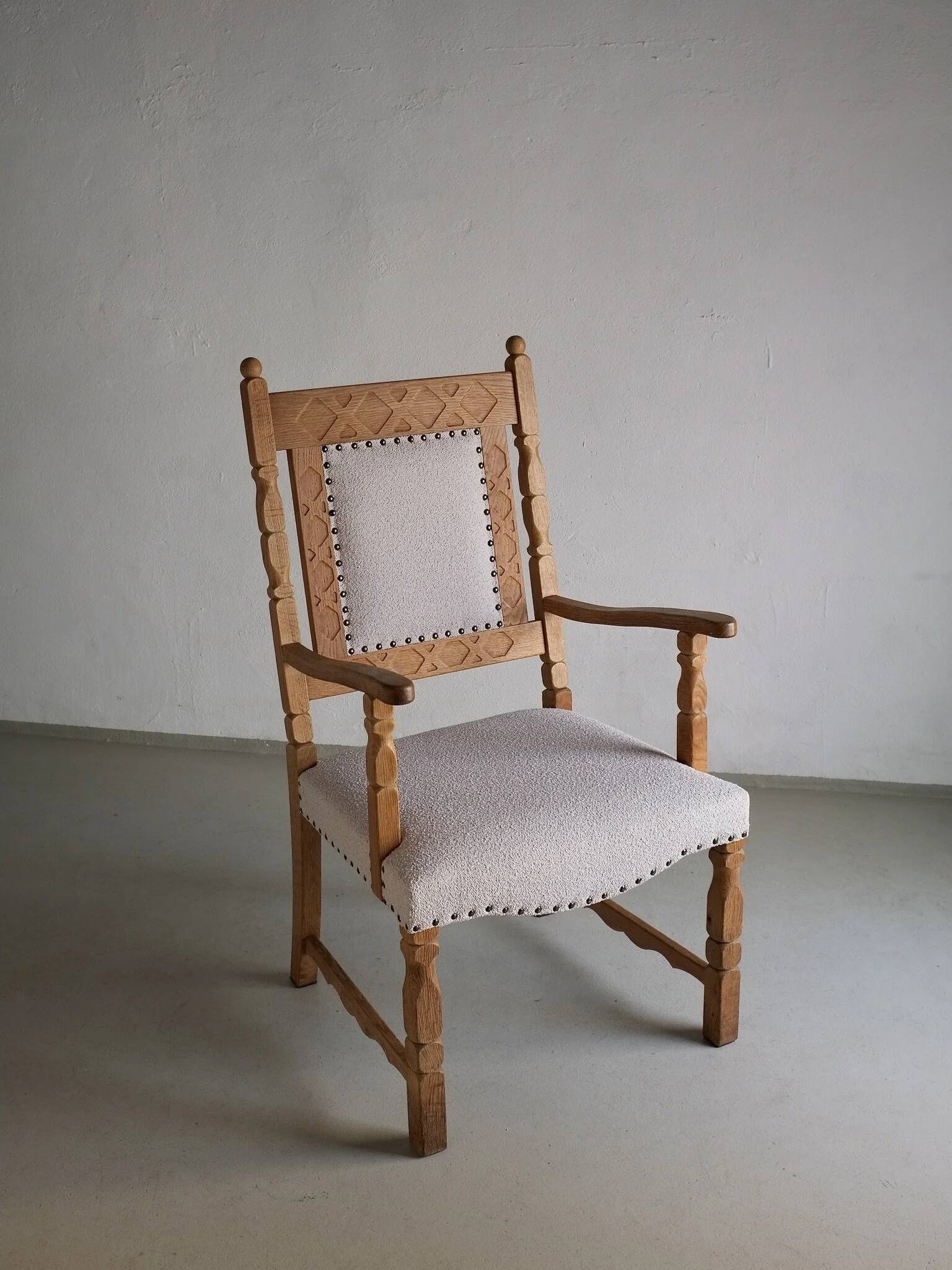 Carved oak armchair by Henning Kjaernulf | Denmark | 1960s