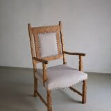 Carved oak armchair by Henning Kjaernulf | Denmark | 1960s