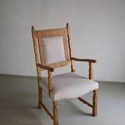 Carved oak armchair by Henning Kjaernulf | Denmark | 1960s