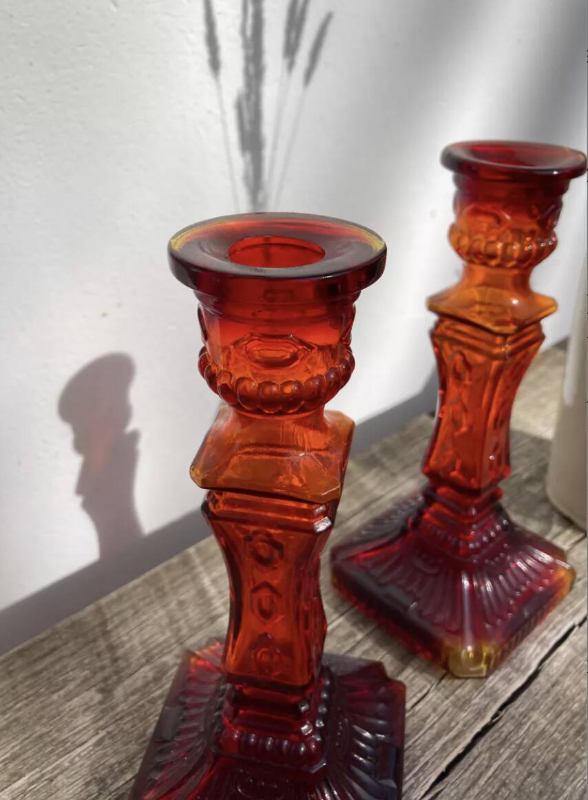 Pair of amber glass candlesticks