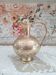 Chiseled brass pitcher decorated foliage