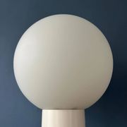 White floor lamp "Close Encounter" and plant stand by Kerst Koopman