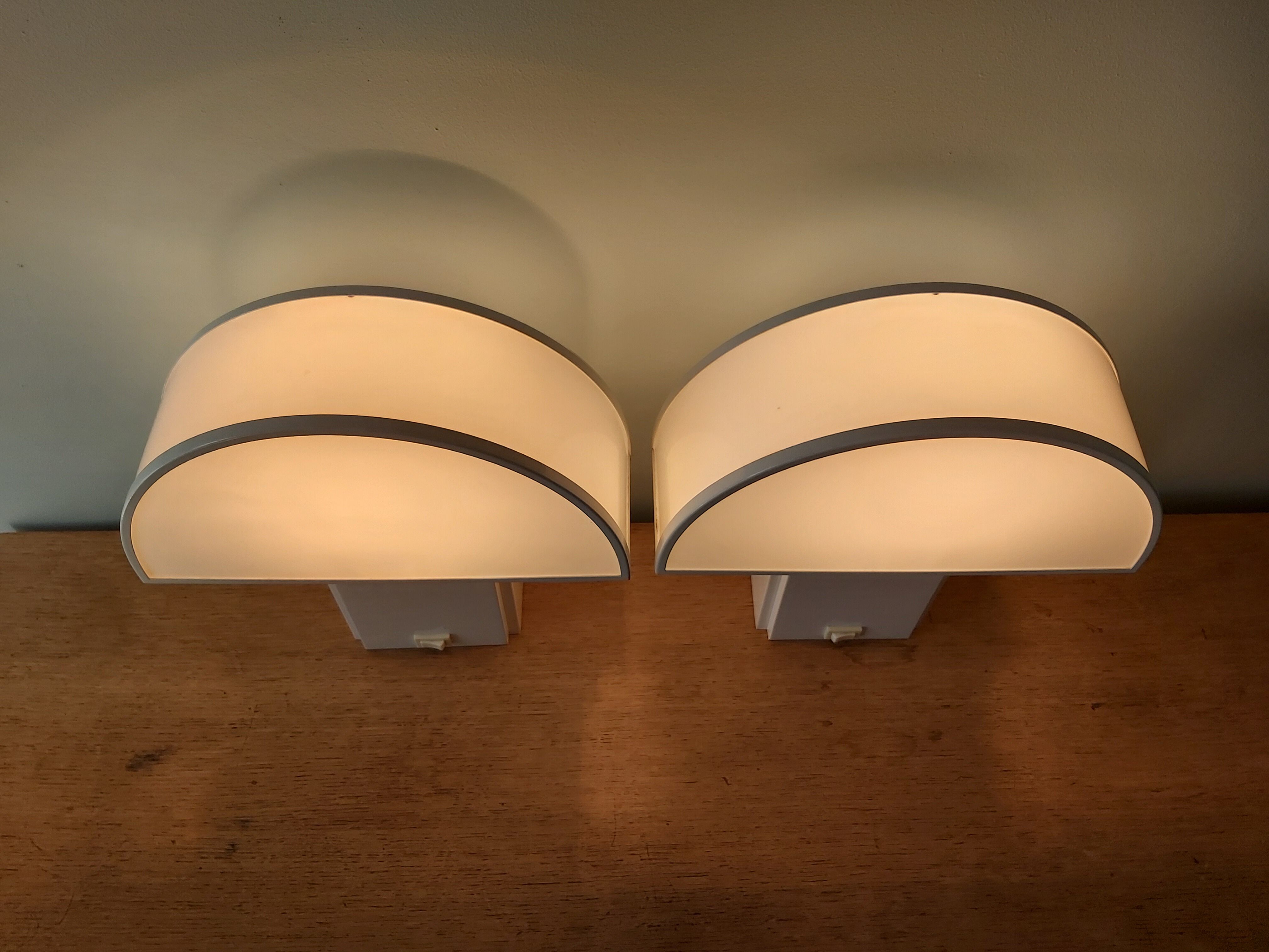 Pair of wall lamps, Olympus model, Harvey Guzzini, 70s