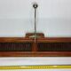 Portemanteau 1900 en métal et bois estampillé Innova, 3 patères