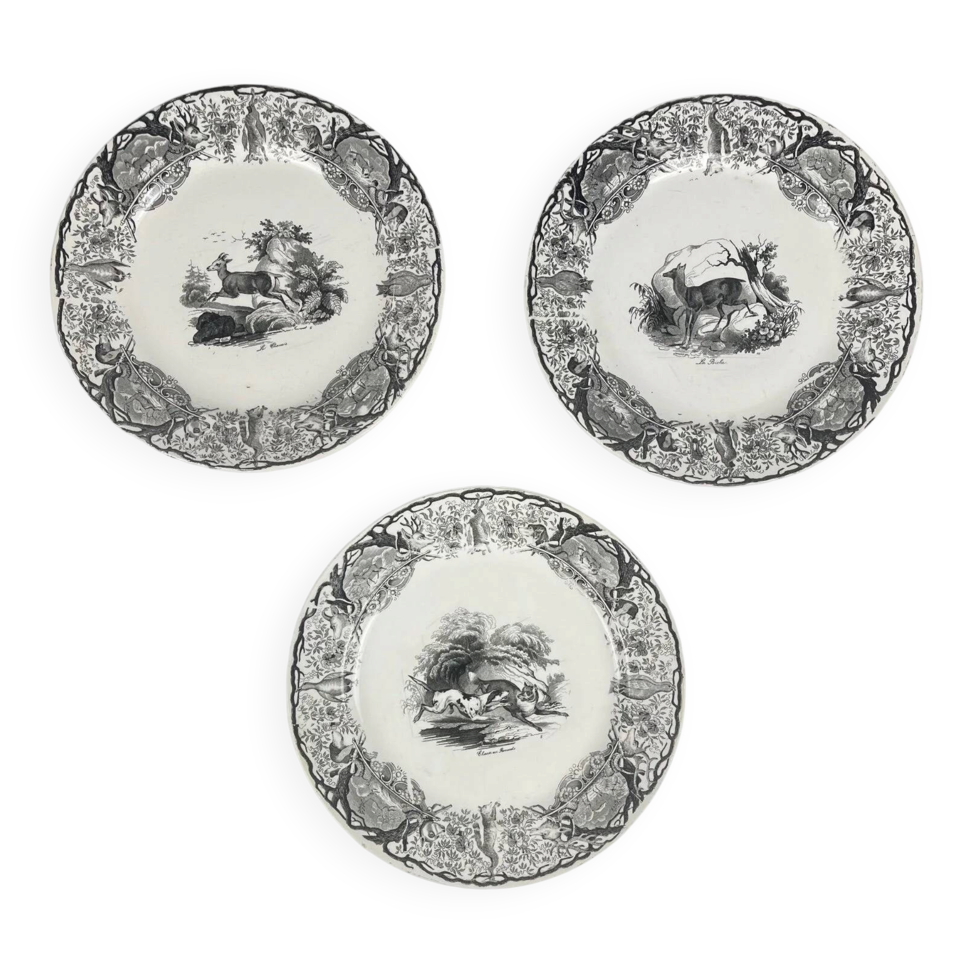 Set of three antique Sarreguemines U&C plates with hunting decoration from 1850 - 19th century black earthenware featuring a doe, chamois, and fox.