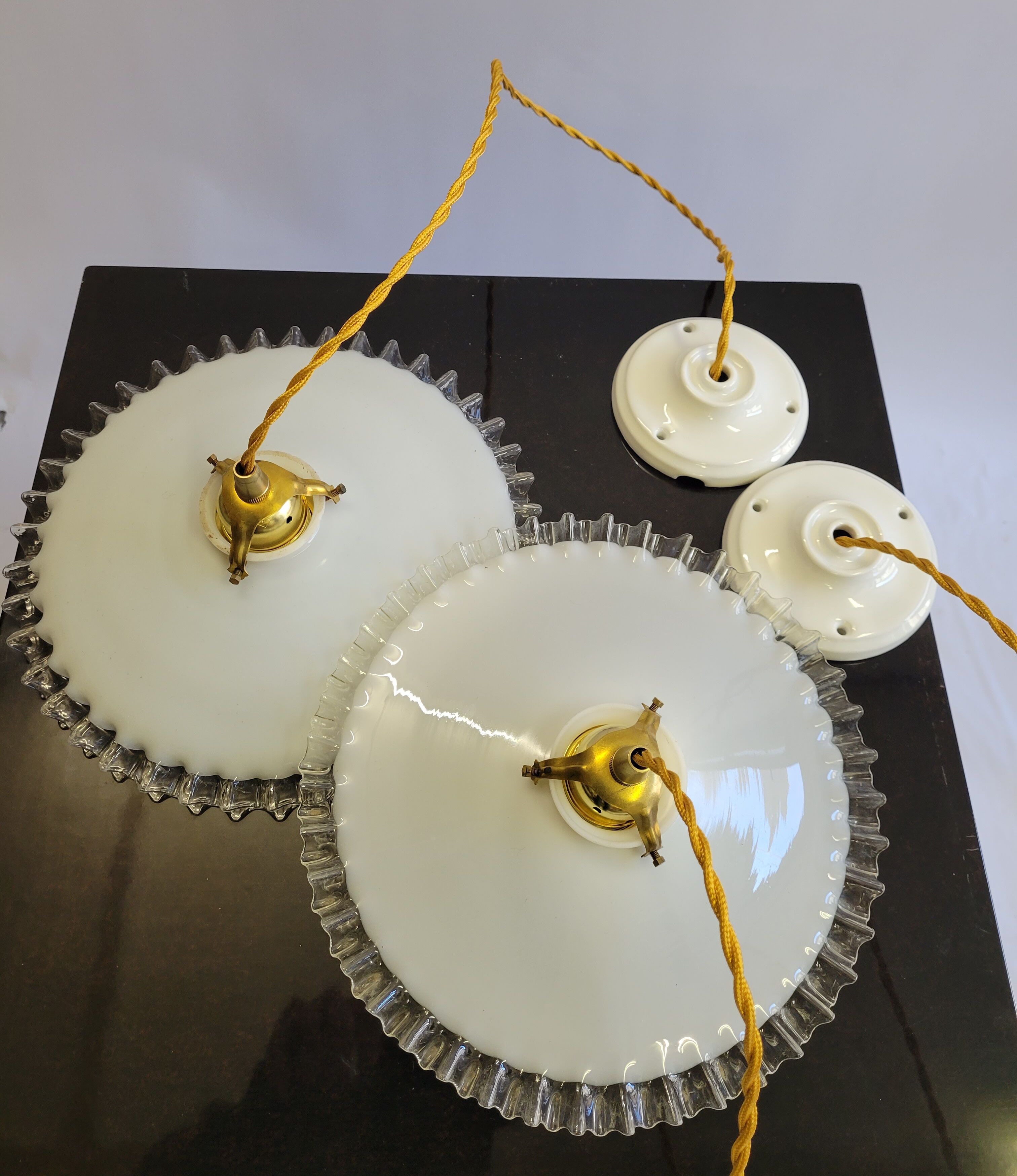 Duo of serrated opaline suspensions