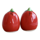 Vintage salt and pepper shakers in red tomato-shaped earthenware.