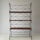 Free-standing shelf with a metal structure and 3 shelves, 1960s, Italy.